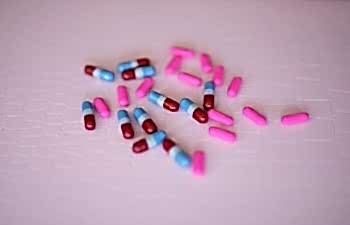 Pills on a pink background