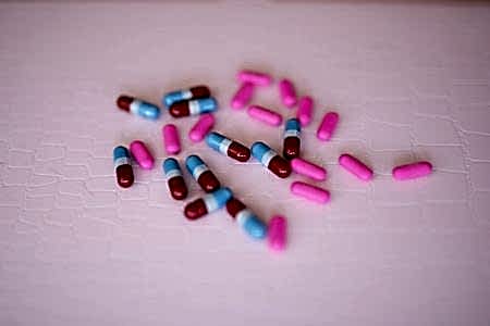 Pills on a pink background