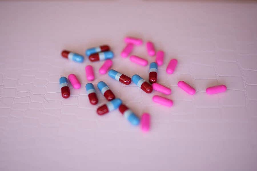 Pills on a pink background