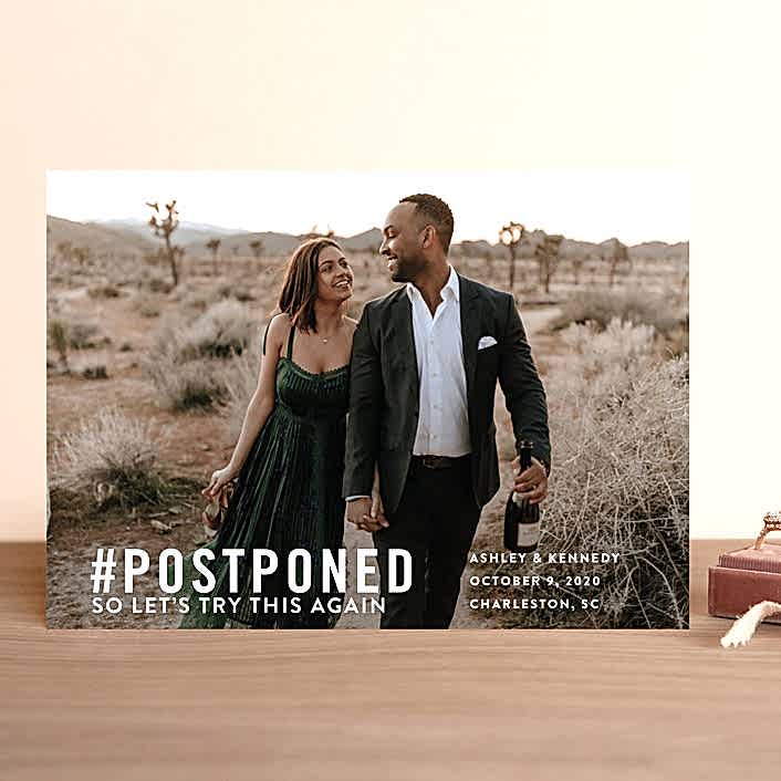 photo of couple gazing at each other holding champagne bottles