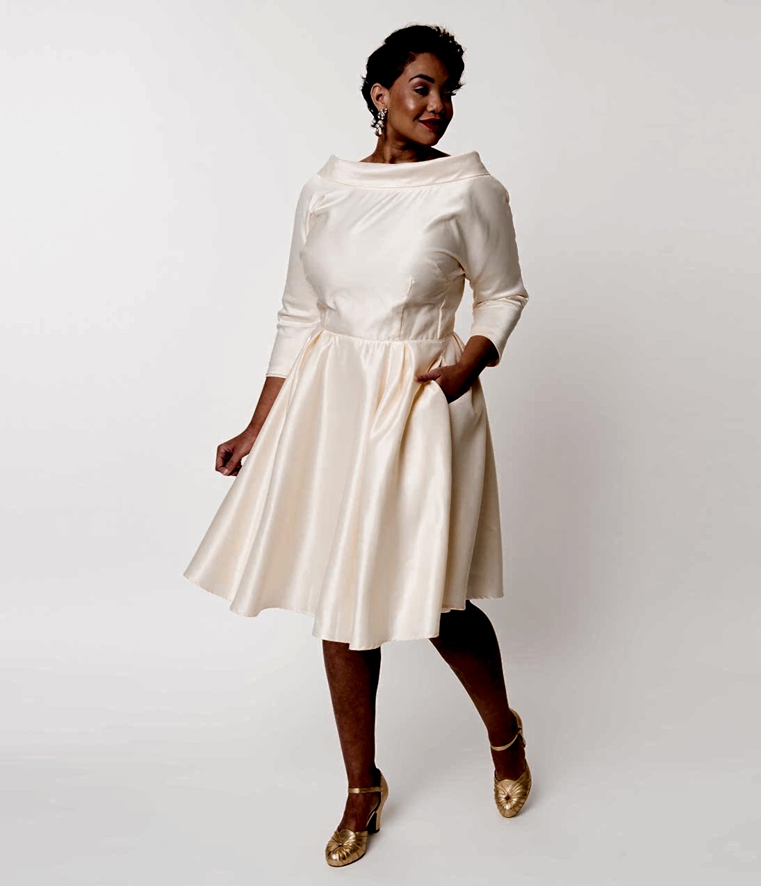 Woman with dark hair in vintage style off-the-shoulder long sleeve wedding dress
