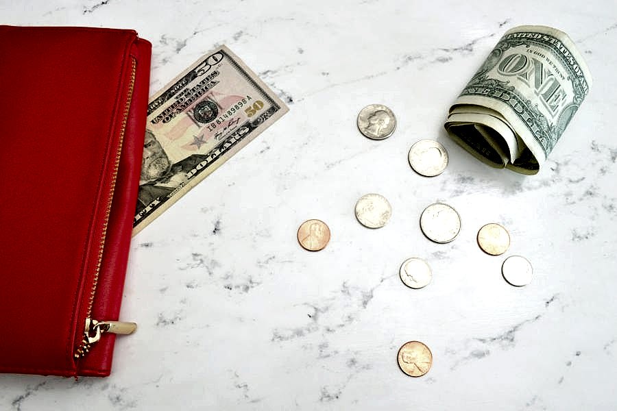 Money next to a purse