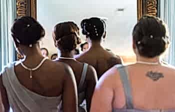 Bridesmaids waiting to enter a room
