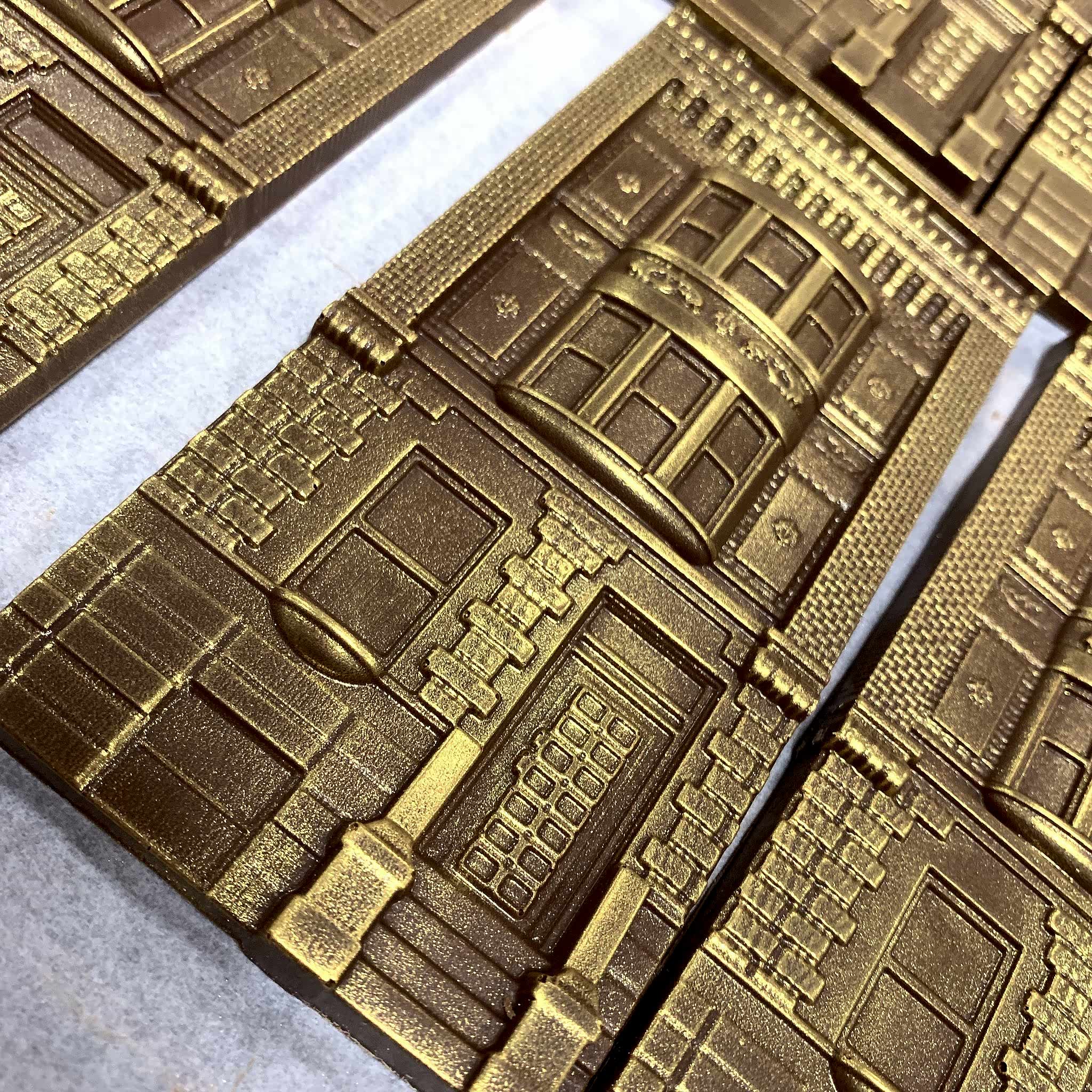 gold dusted milk chocolate shaped like houses in harlem