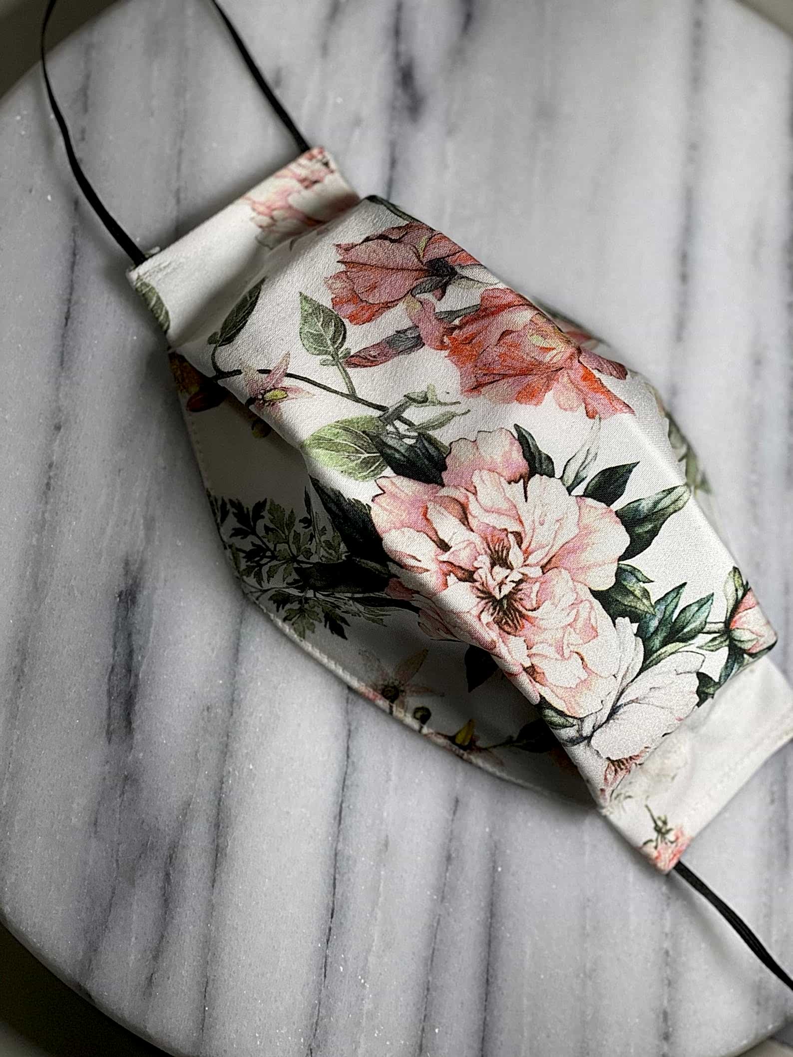 floral mask on marble background