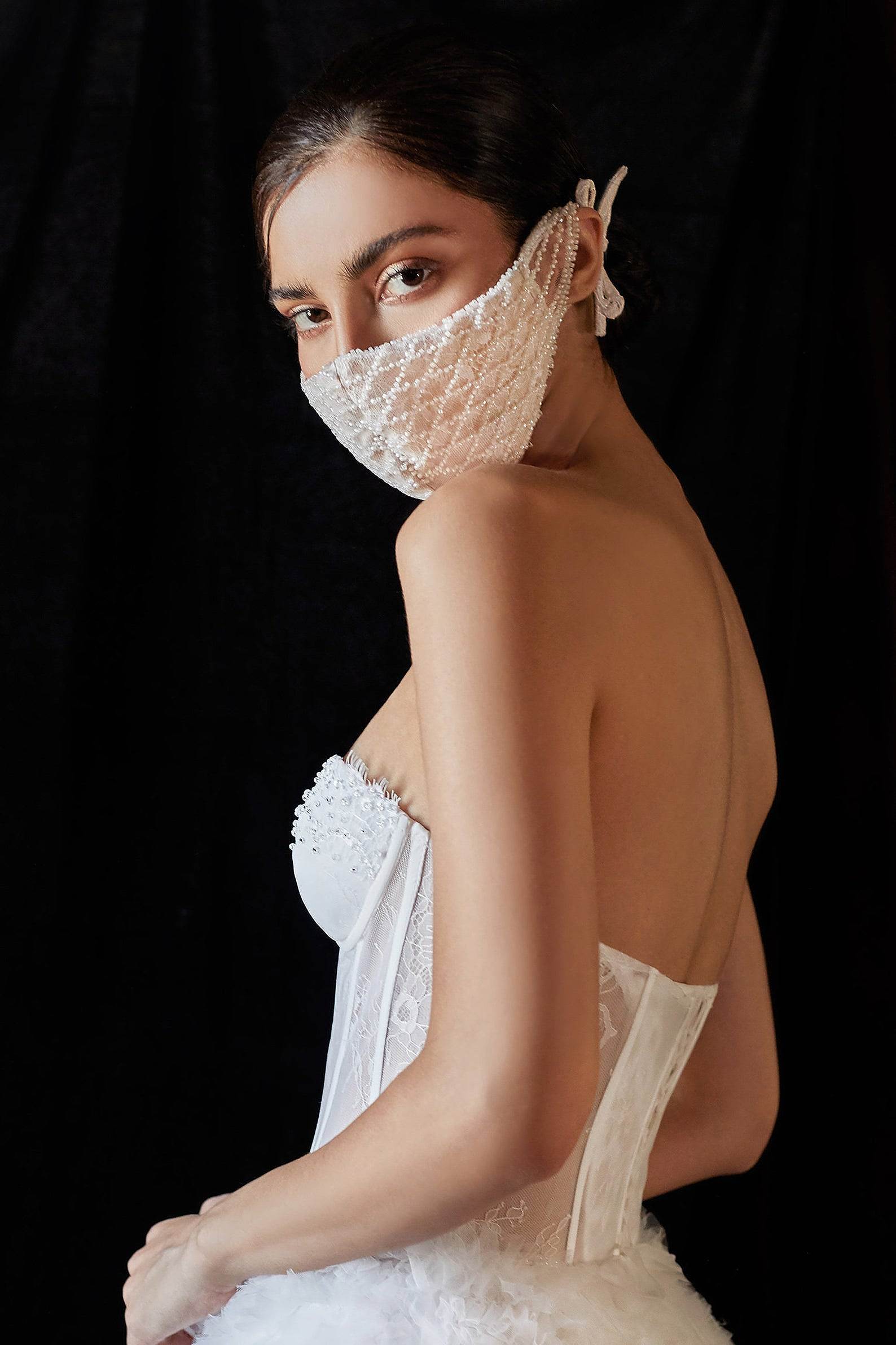 bride wearing beaded mask