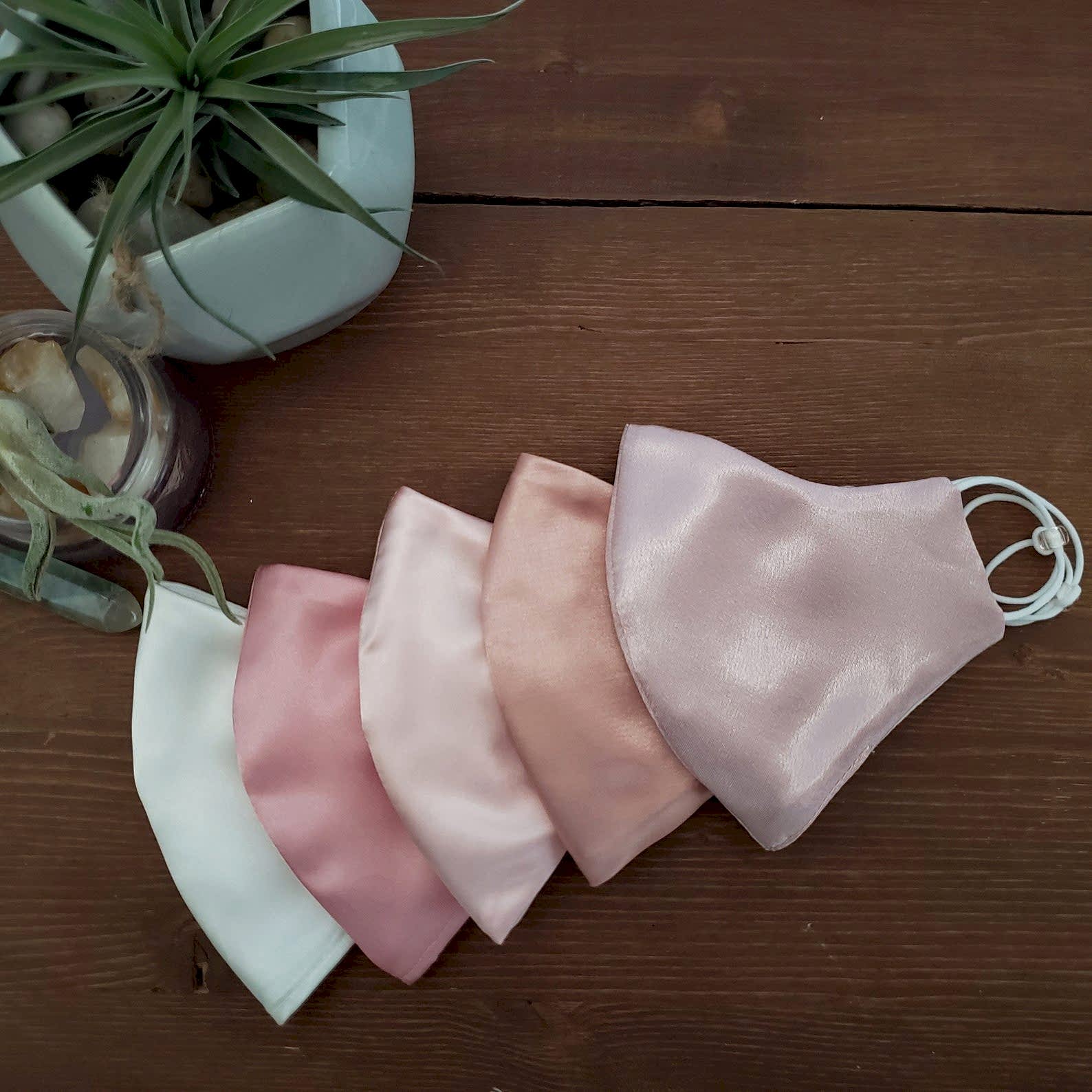 A set of 5 pink face masks