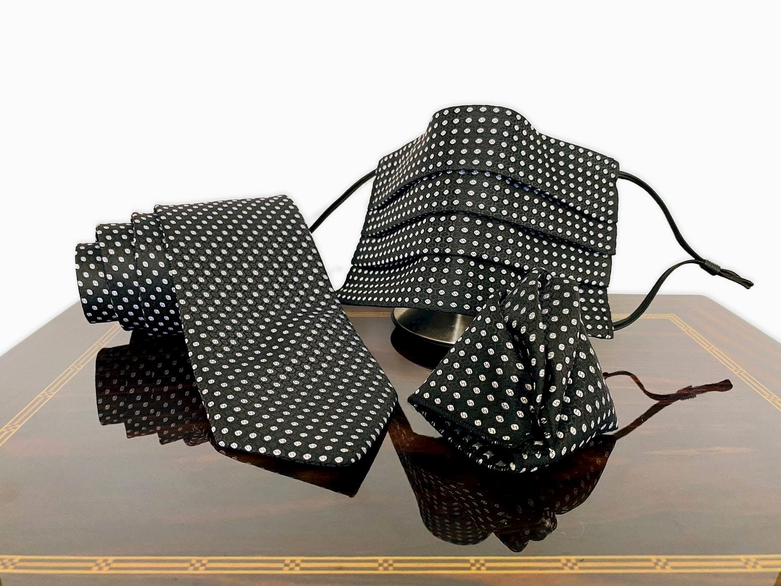 matching black and white polka dot face mask and tie set
