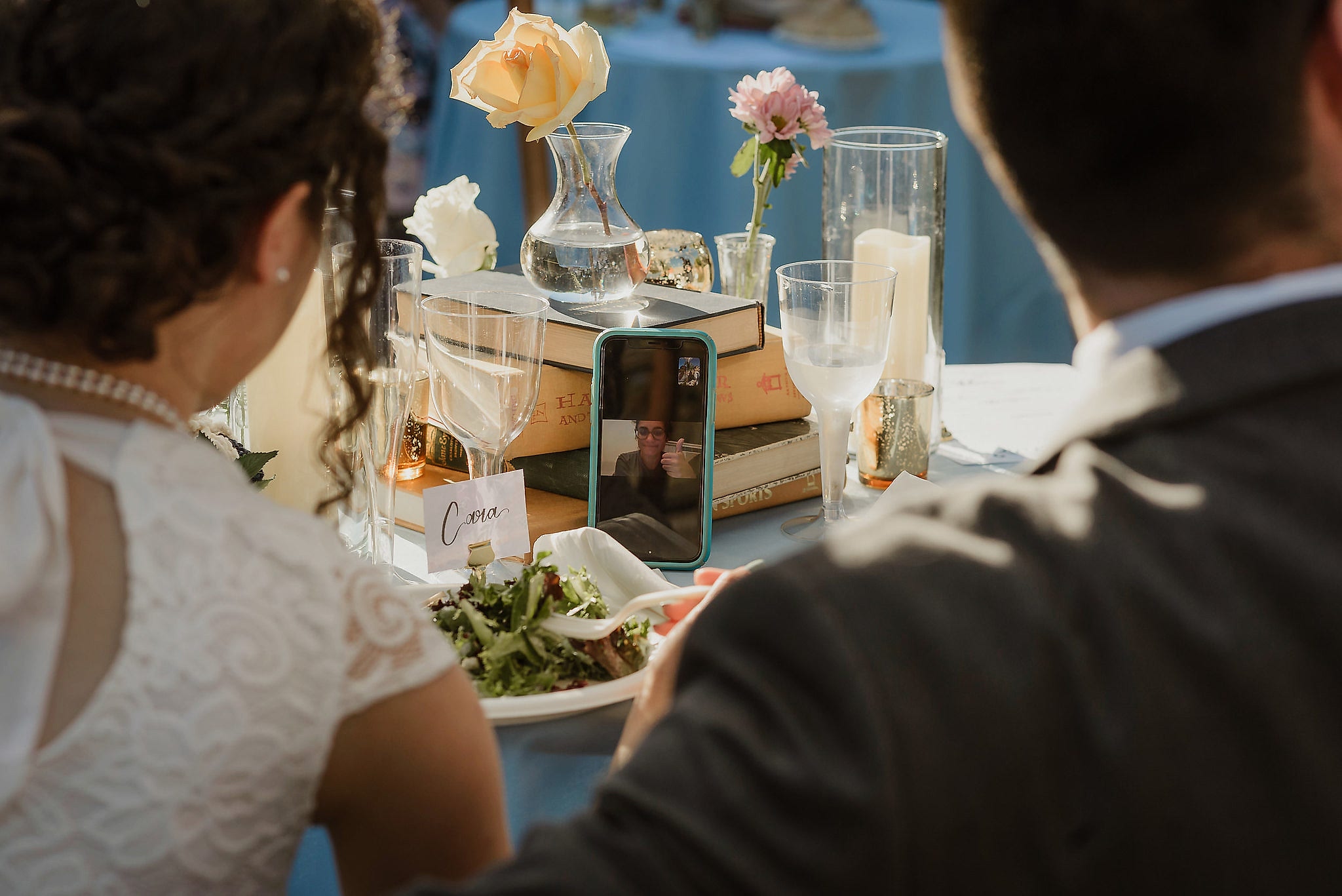 wedding couple on FaceTime during reception