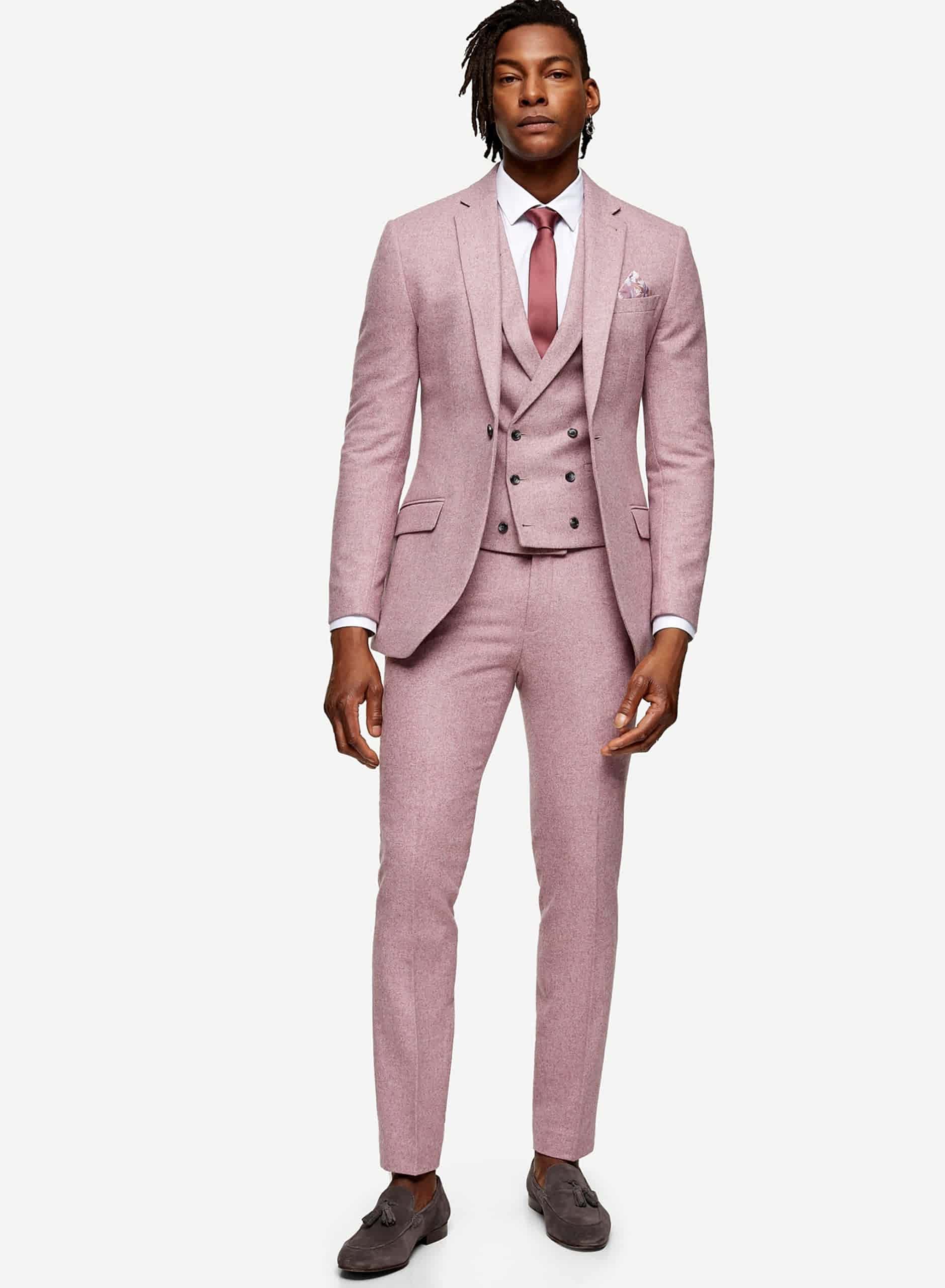 man wearing a pink 3 piece suit