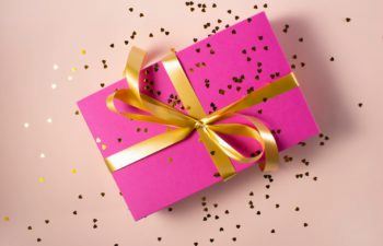 wrapped anniversary gift with confetti