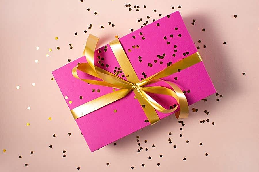 wrapped anniversary gift with confetti