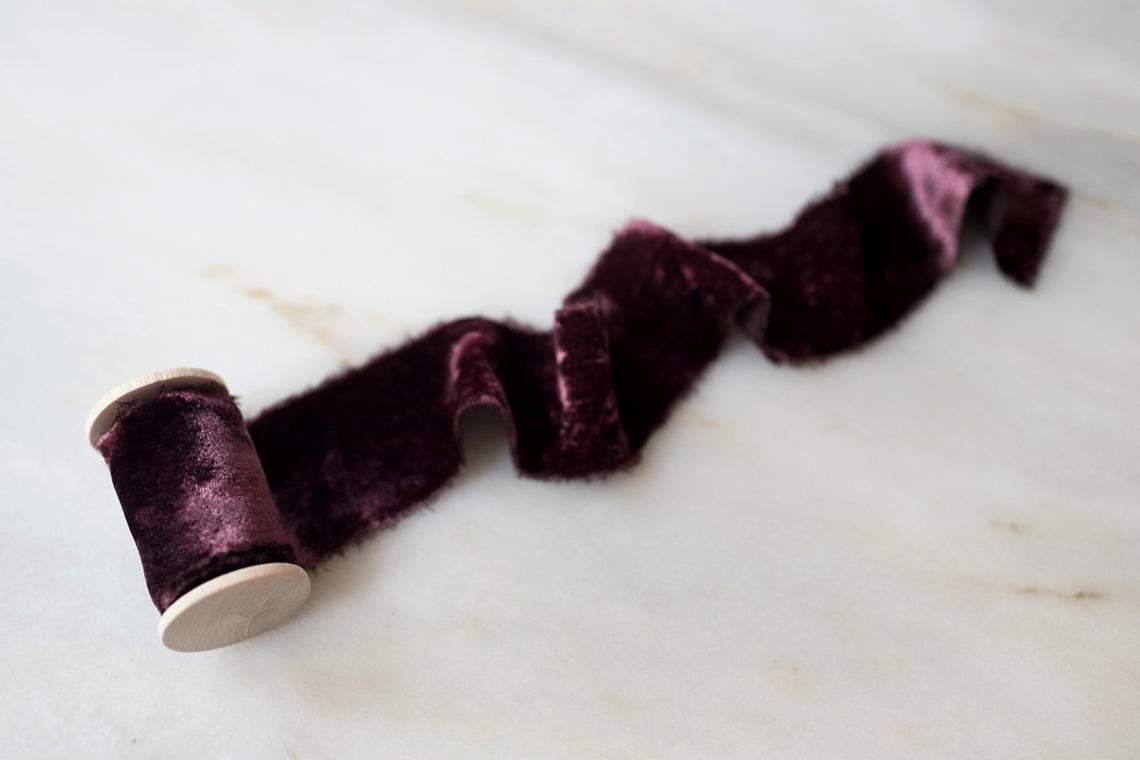 merlot red velvet ribbon on a spool