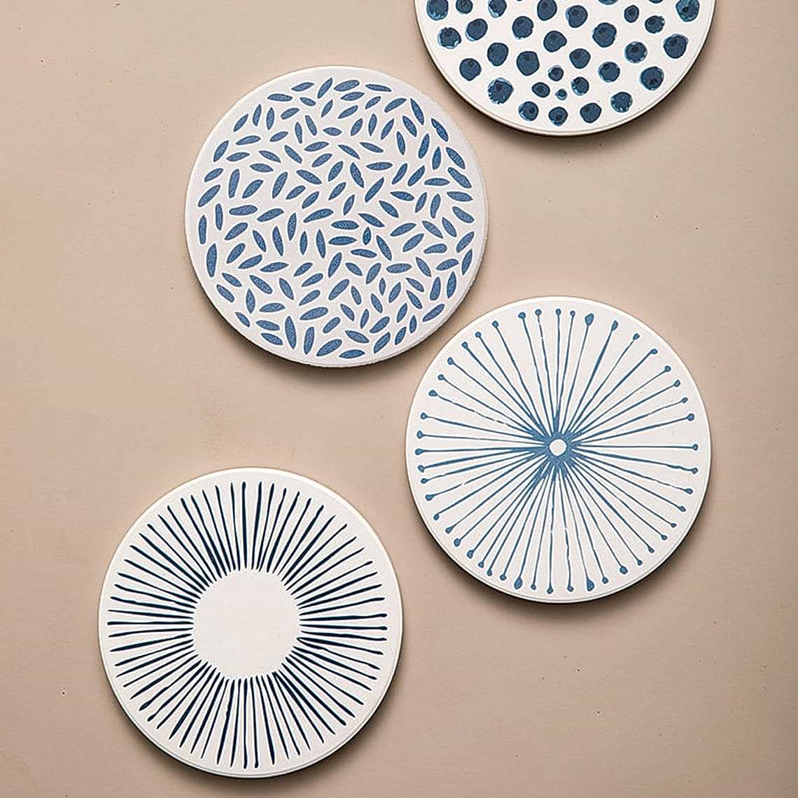 white and blue patterned ceramic drink coasters