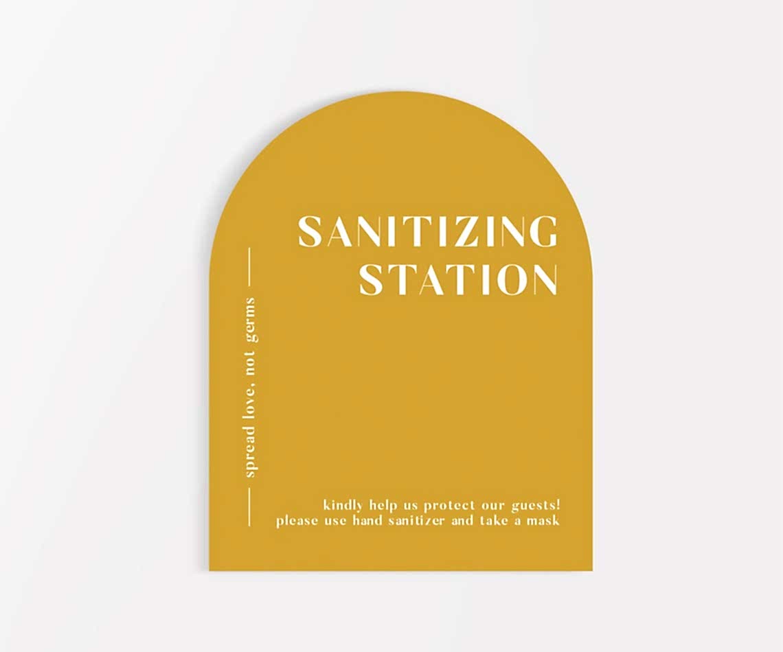 mustard yellow arched sanitizing station sign