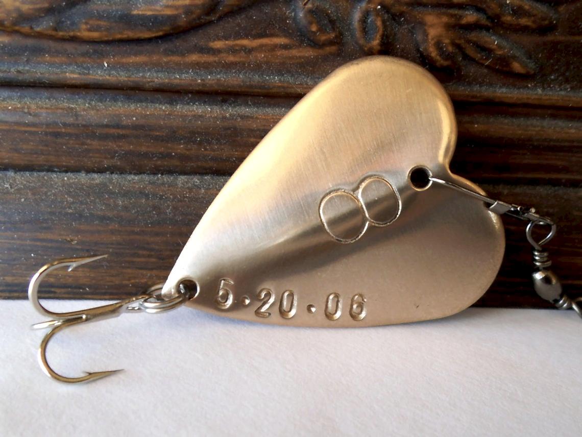 For a more traditional anniversary gift try a custom embossed bronze fishing lure in shape of a heart
