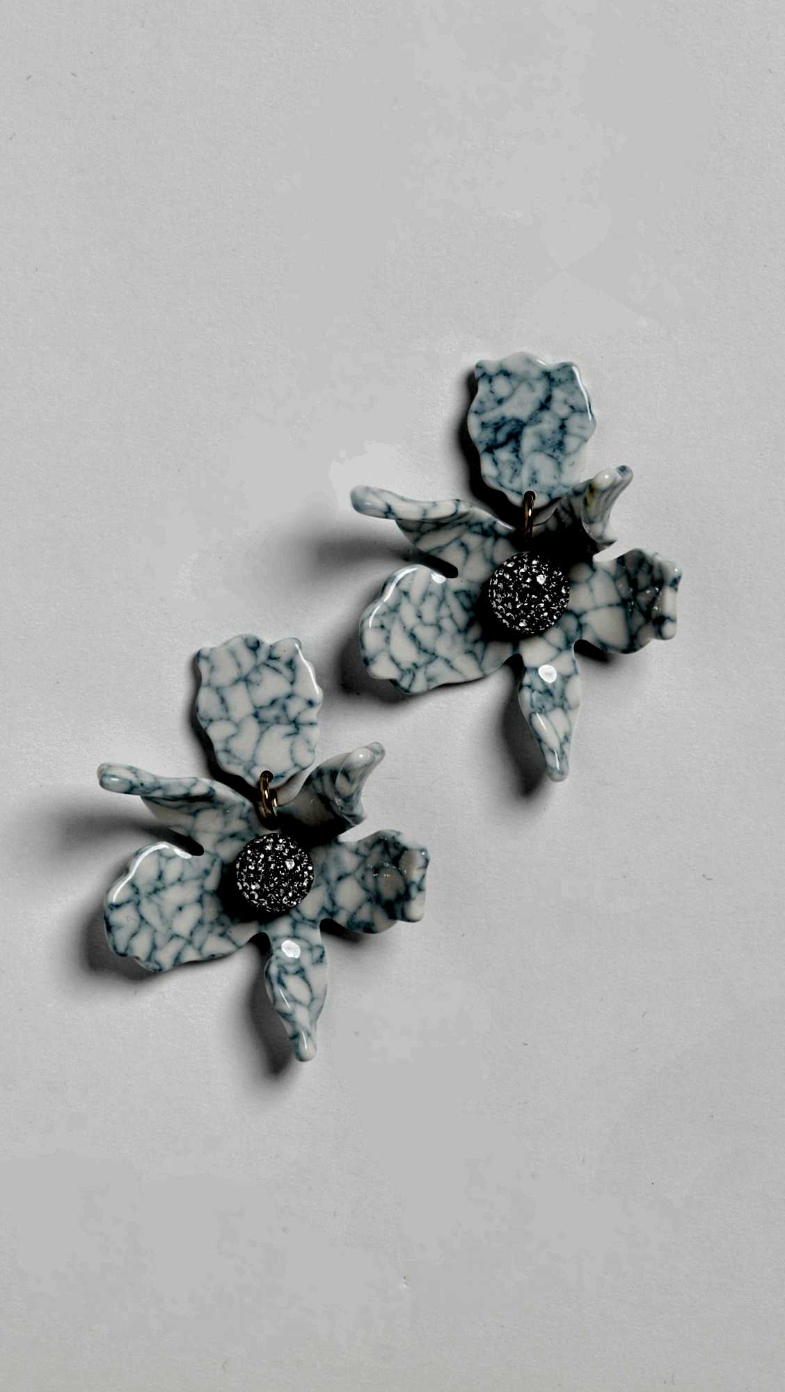blue marble orchid flower shaped earrings with rhinestone centers