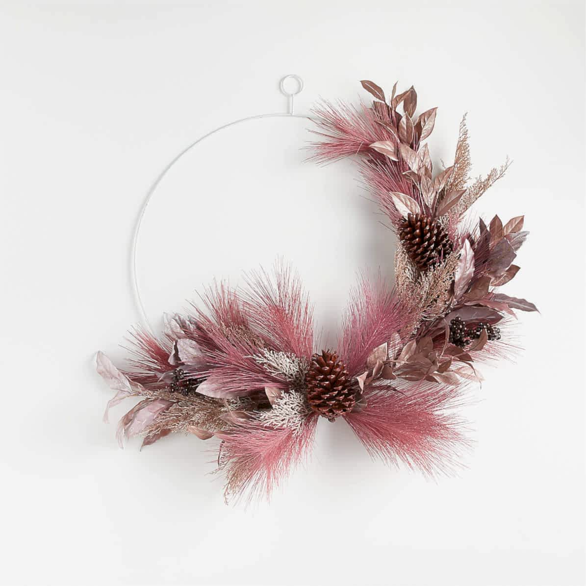 pink faux floral wreath on metal hoop