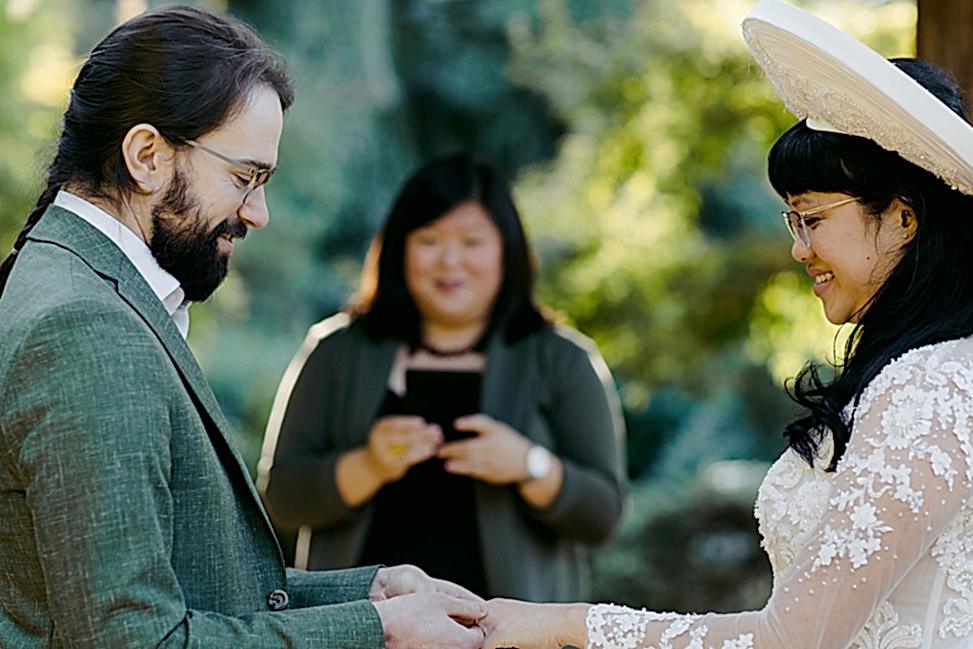 Image of couple during wedding ceremony, listening to wedding poem