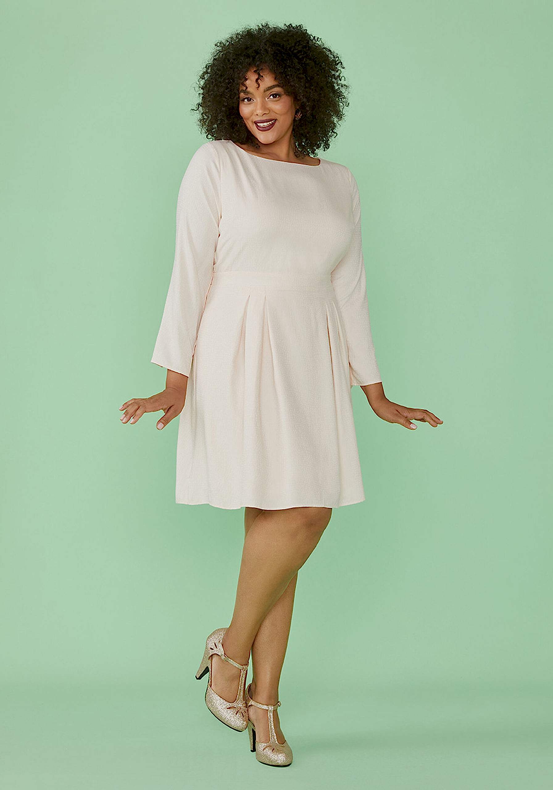 woman wearing fit and flare white dress