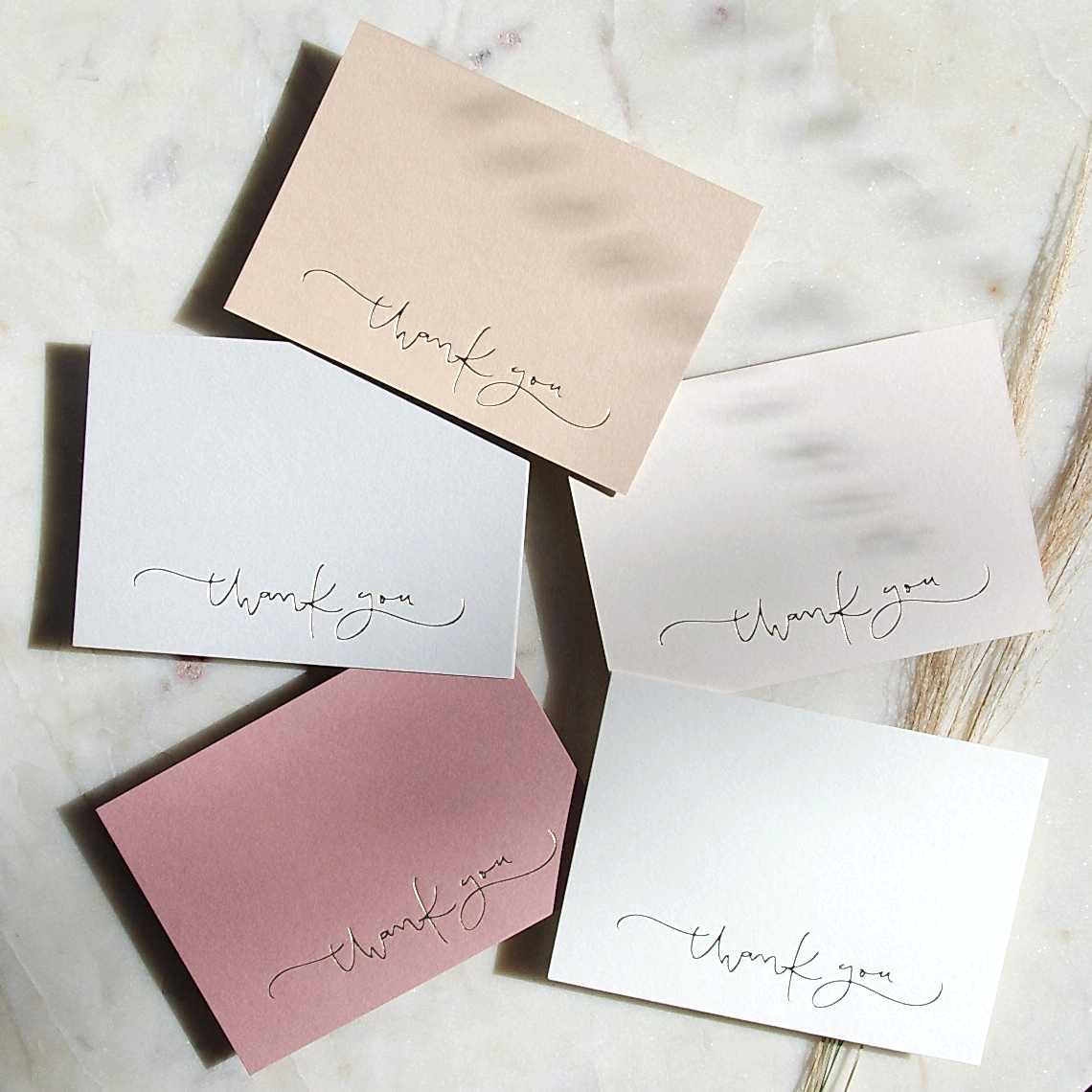 set of pink and gold cards