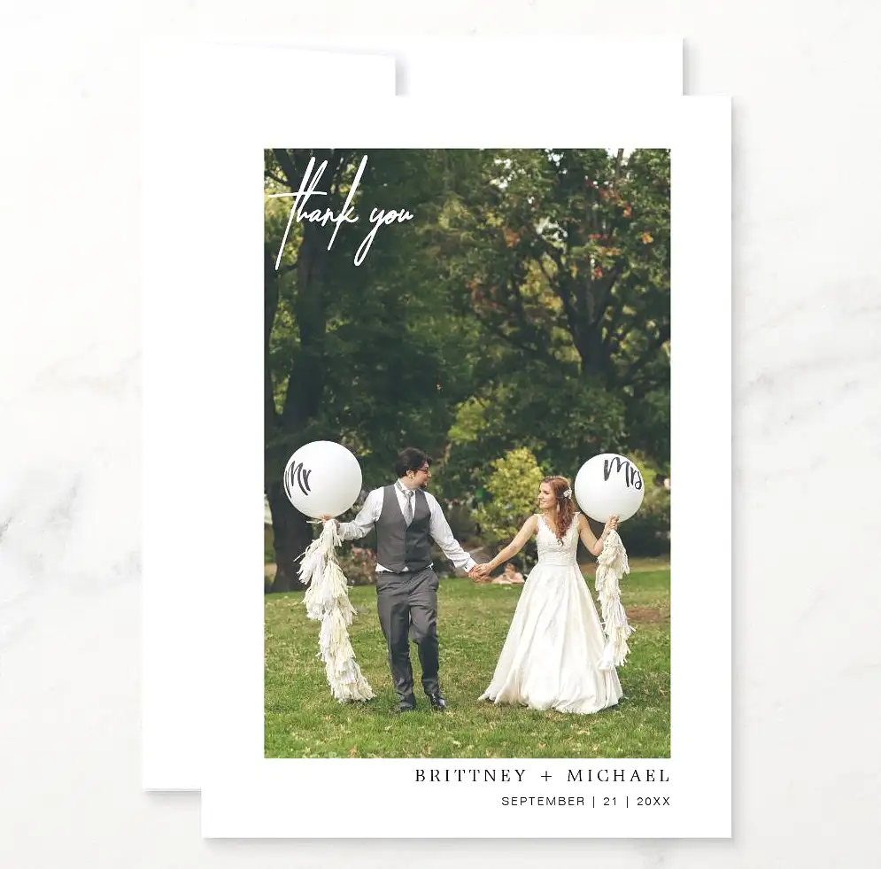 simple wedding thank you card with couple holding balloons