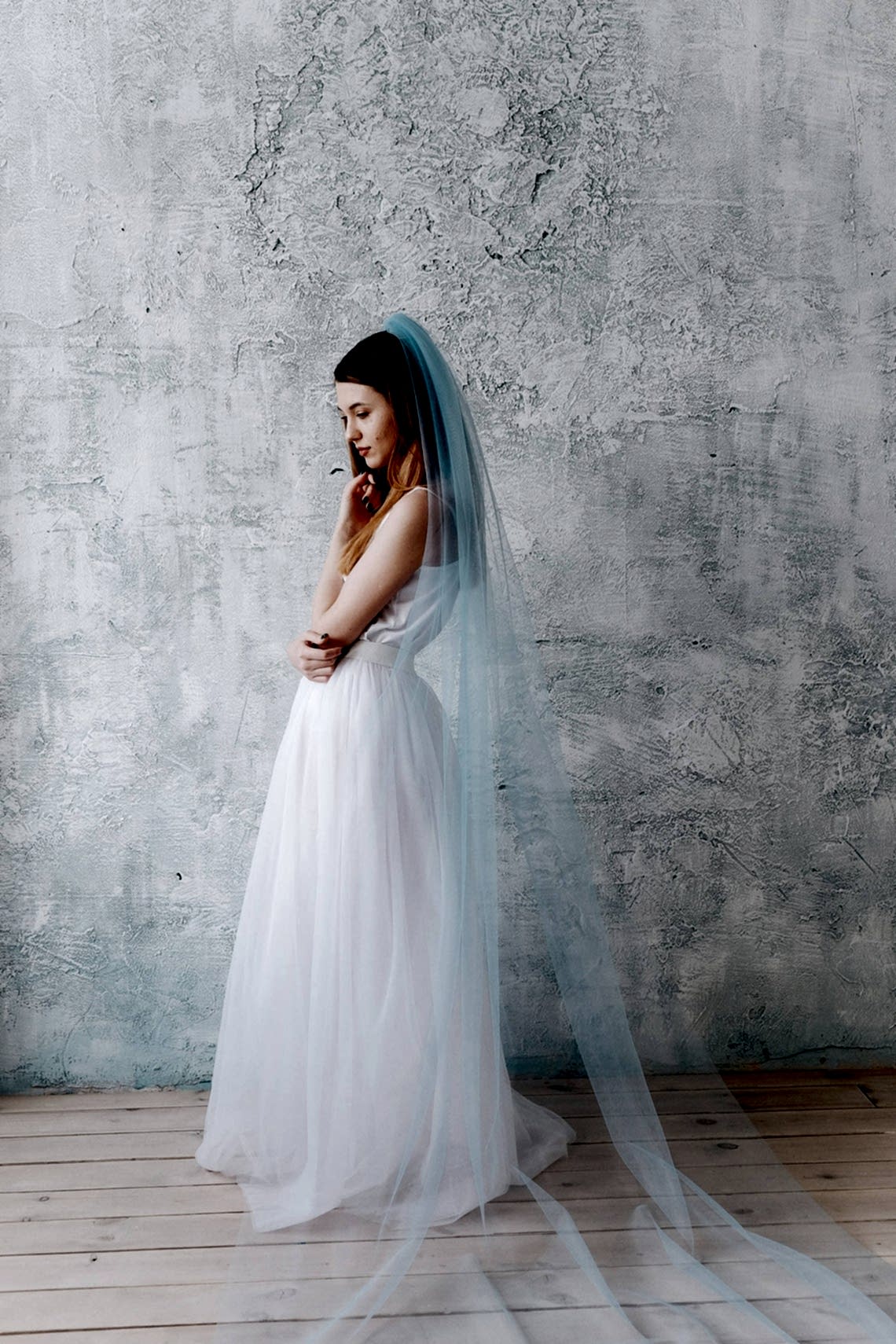 woman wearing long blue veil