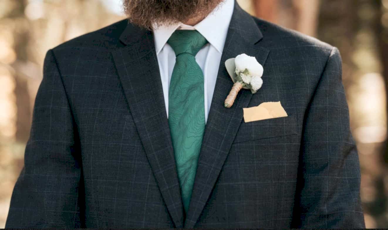 man wearing green topographic tie