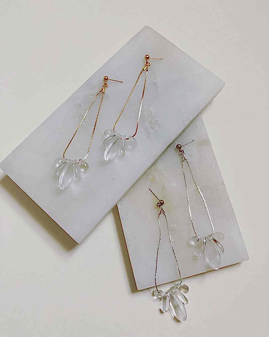 drop earrings on marble tray