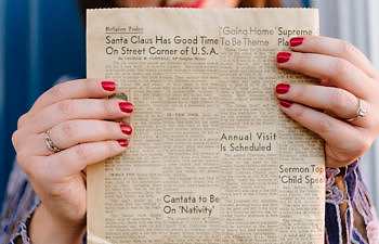 hands holding holiday paper
