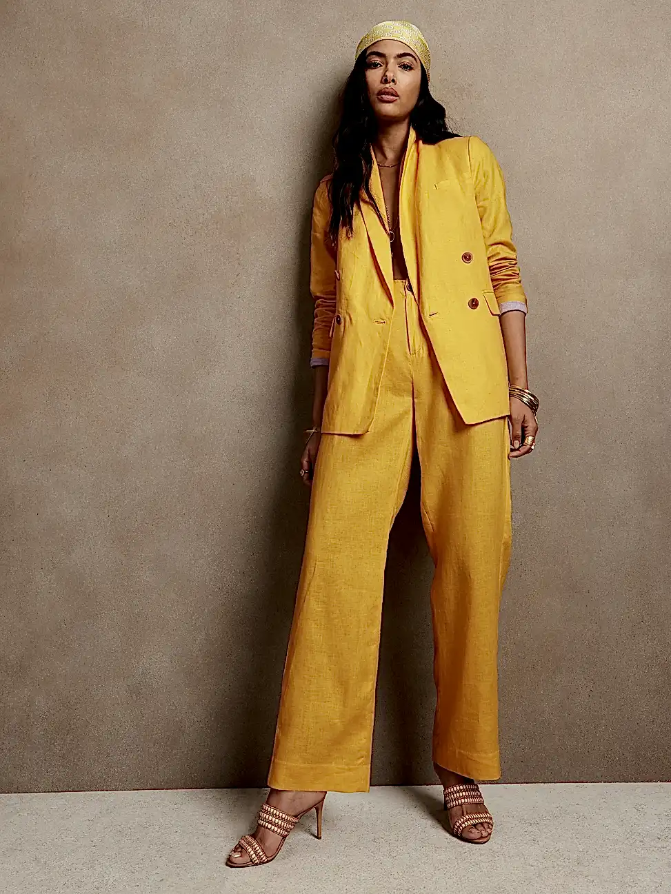 woman wearing yellow linen suit